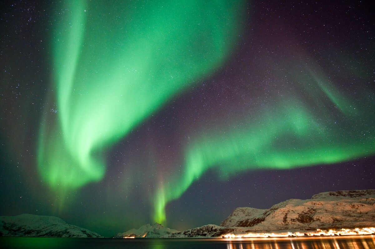Northern Lights over the winter landscape near Tromsø