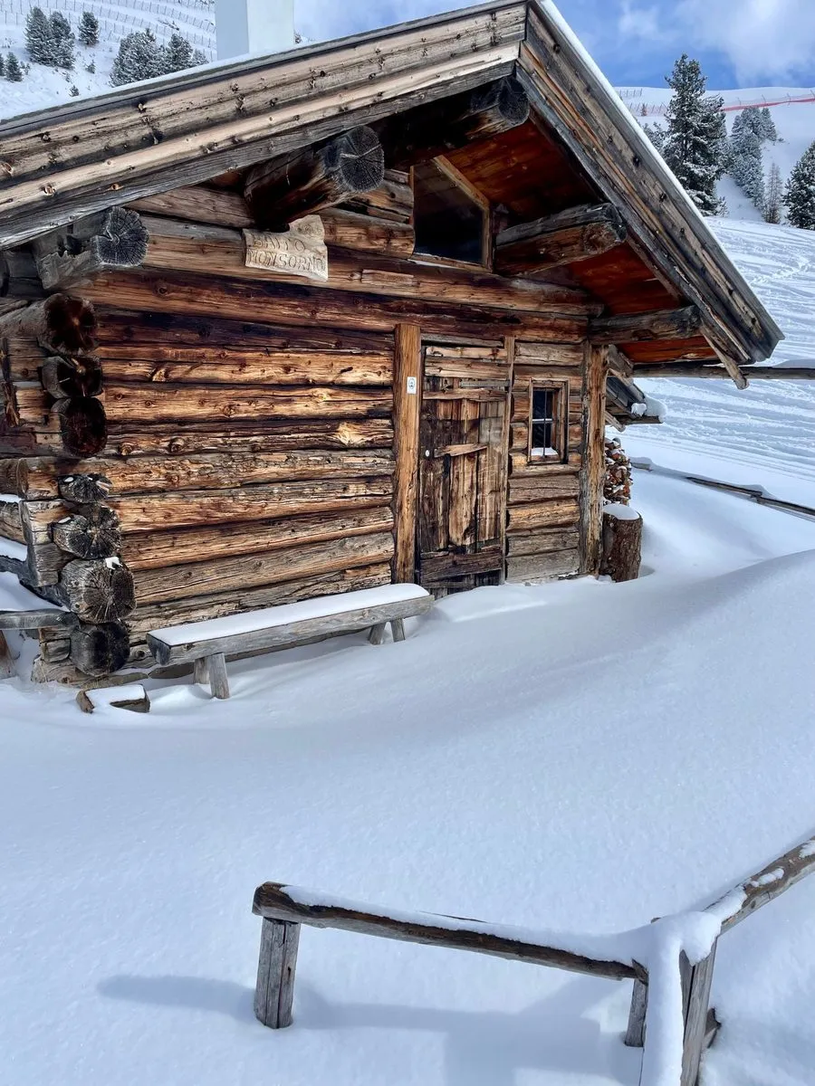 Traditional wooden log cabin covered in snow in Levi, Finnish Lapland