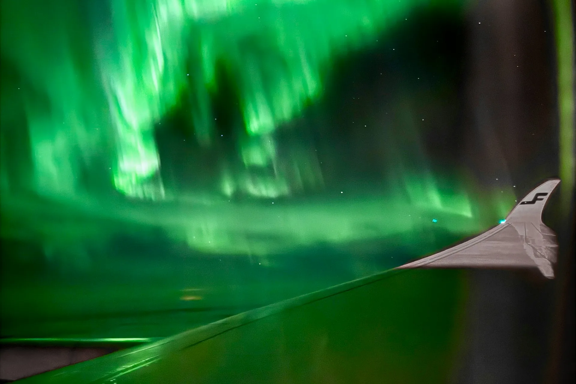 northern lights from the Finnair airplane window