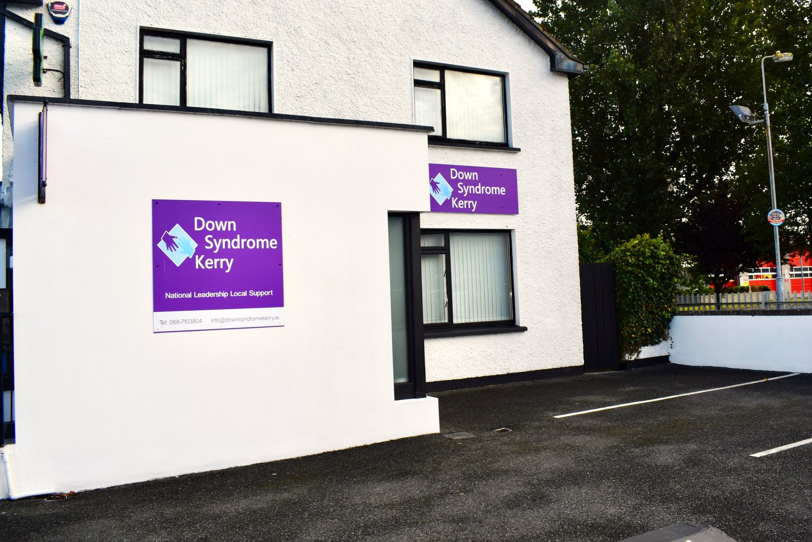 Down Syndrome Kerry office with purple signs