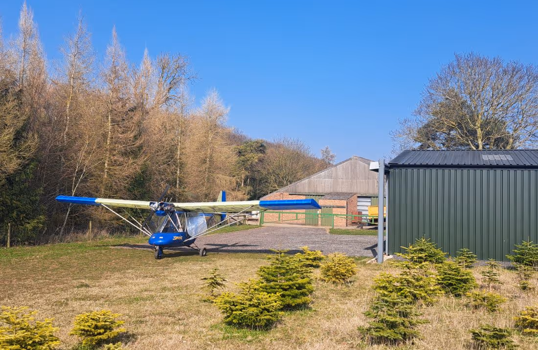 Light aircraft outside the hanger at the Sycamore and Stars air strip.