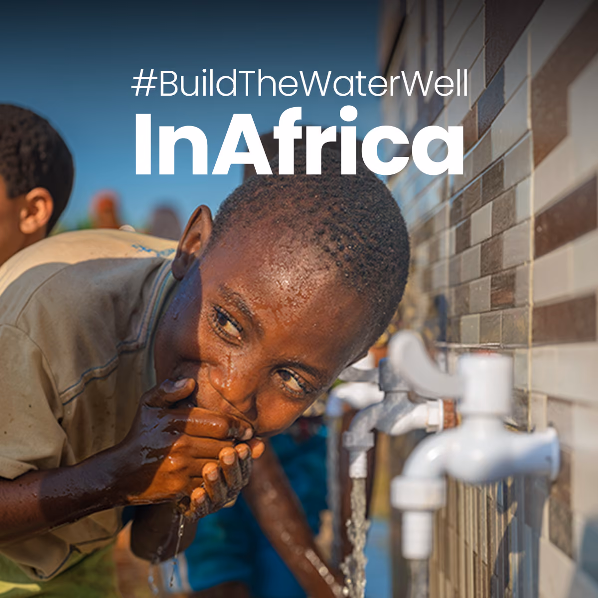 Child drinking water from outdoor taps on a tiled wall under a #BuildTheWaterWellInAfrica sign.