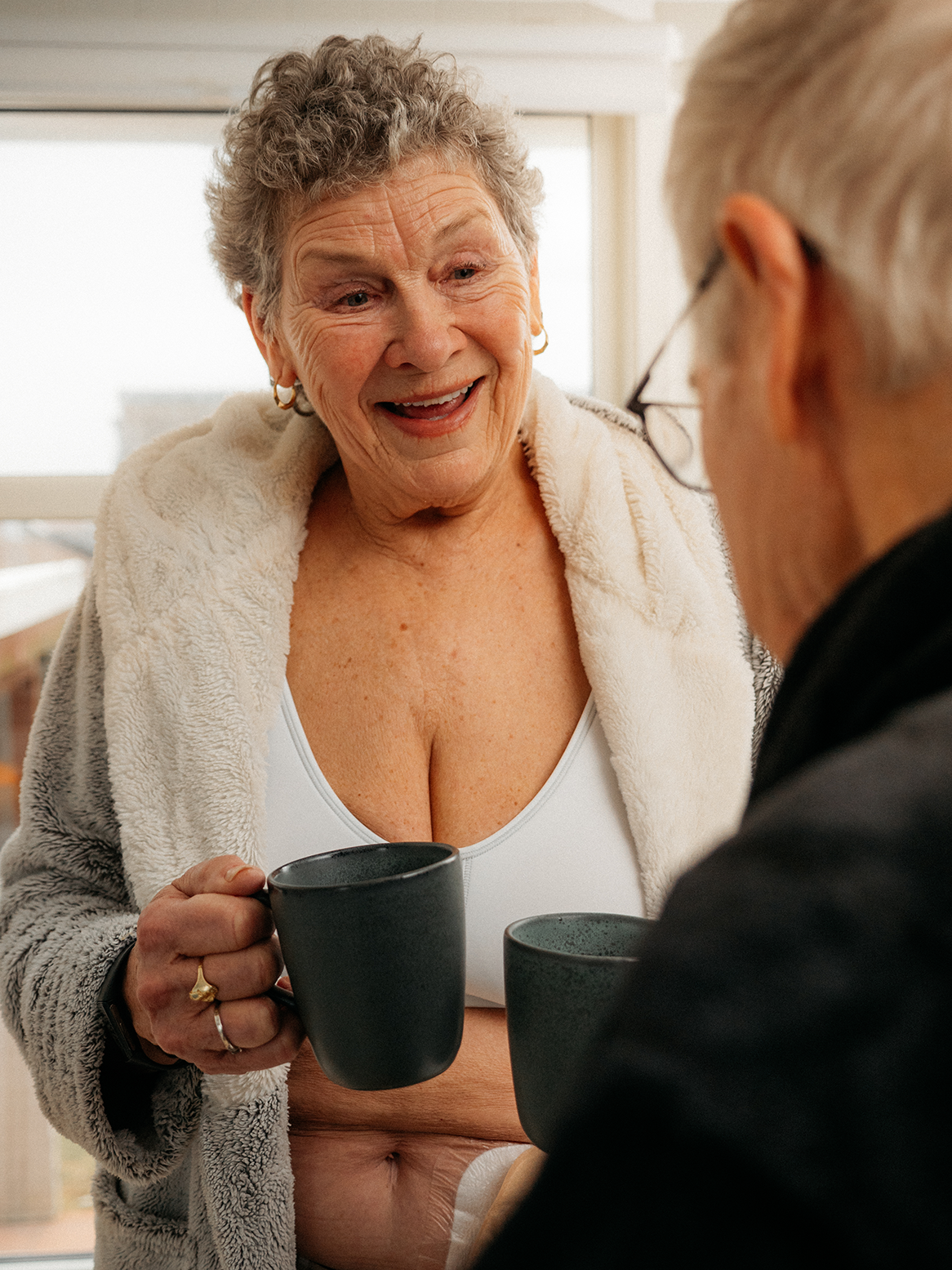 woman kitchen coffee ostomy bag happy