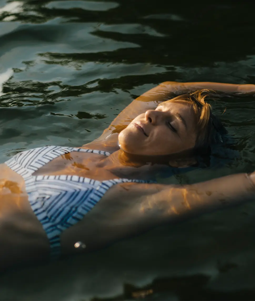 Woman relaxing in a pool