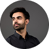 An image of Outtake's CEO, Alex Arjun Dhillon with a gray backdrop.