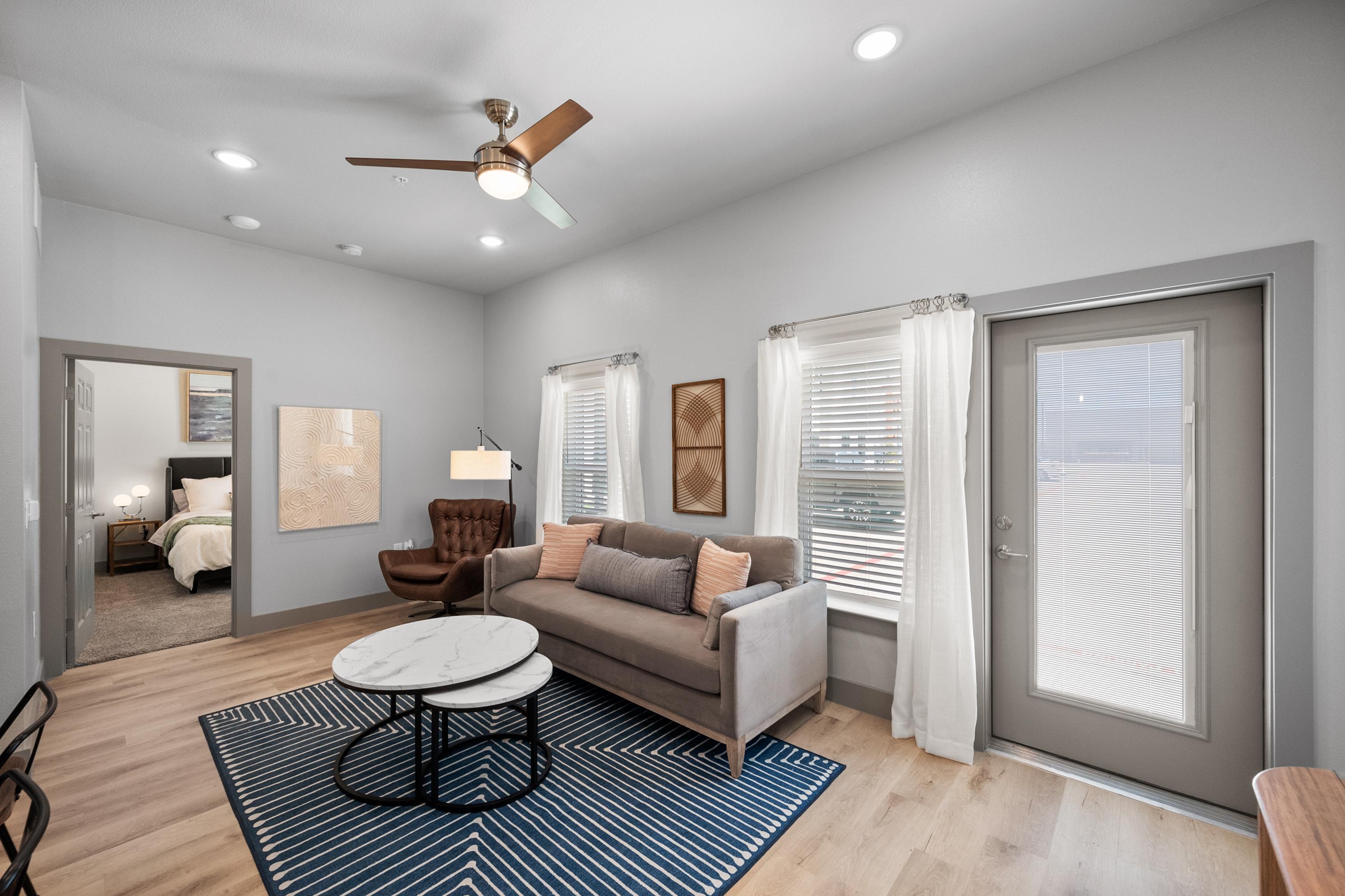well lit Living room with couch and chair