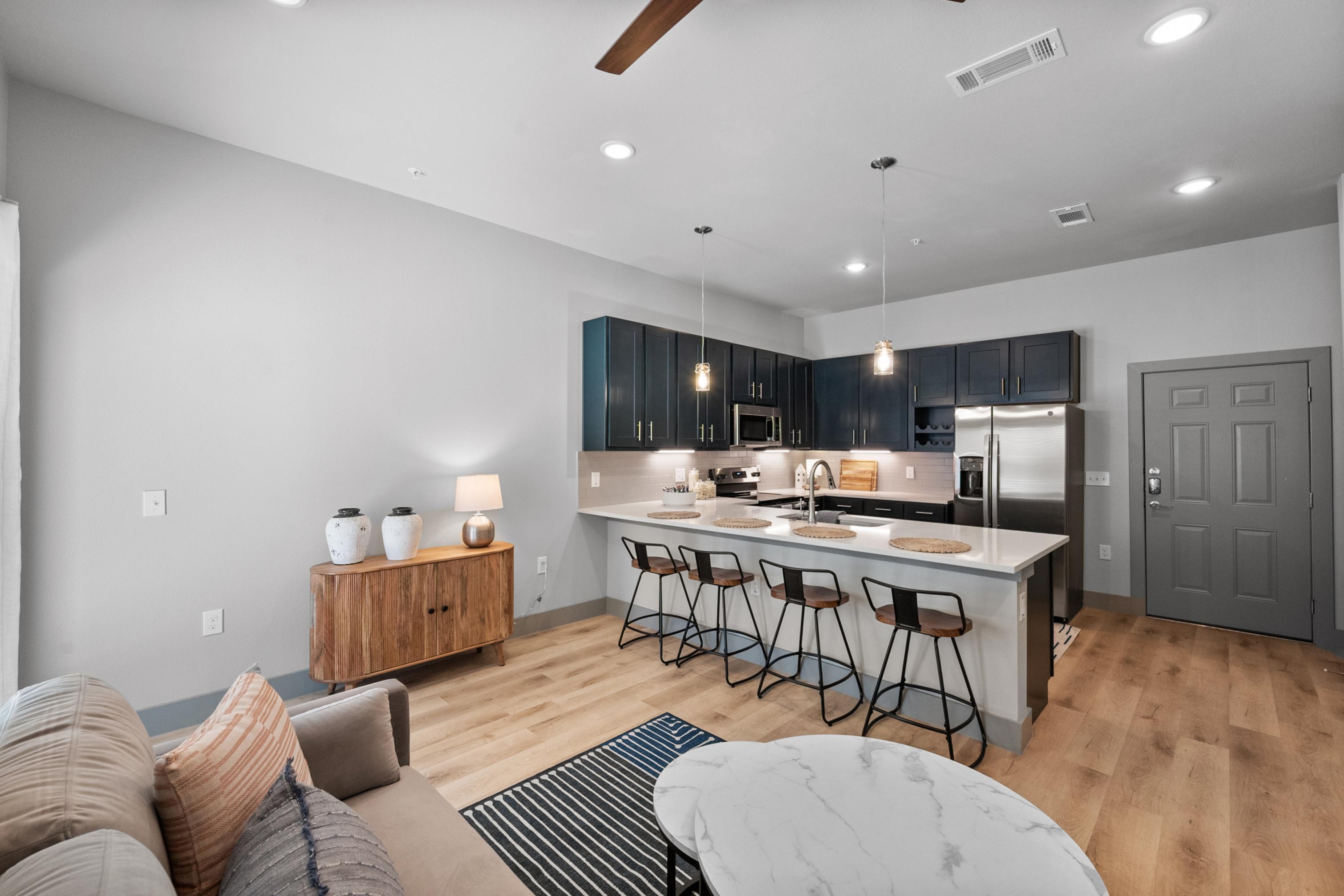 Living room and kitchen with bar seating