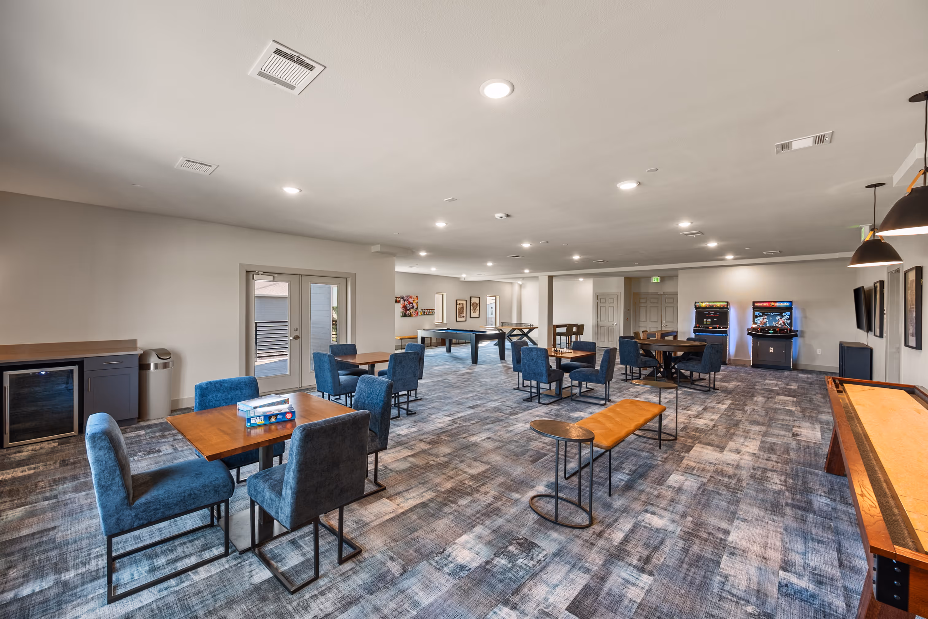 Game room with table and arcade games