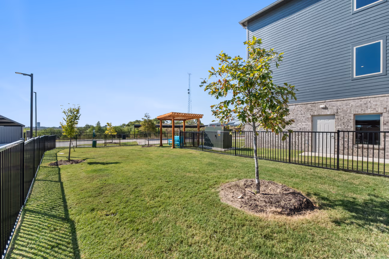 Dog park featuring cabana sitting area with chairs