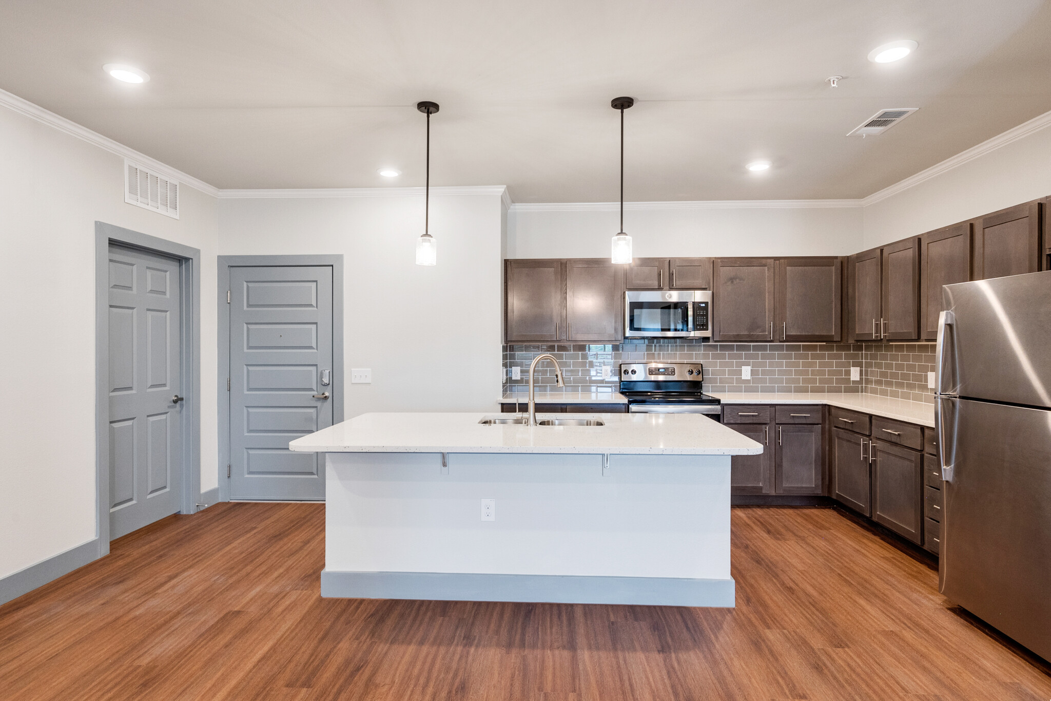 Kitchen with brown cabinets and stainless steel appliances