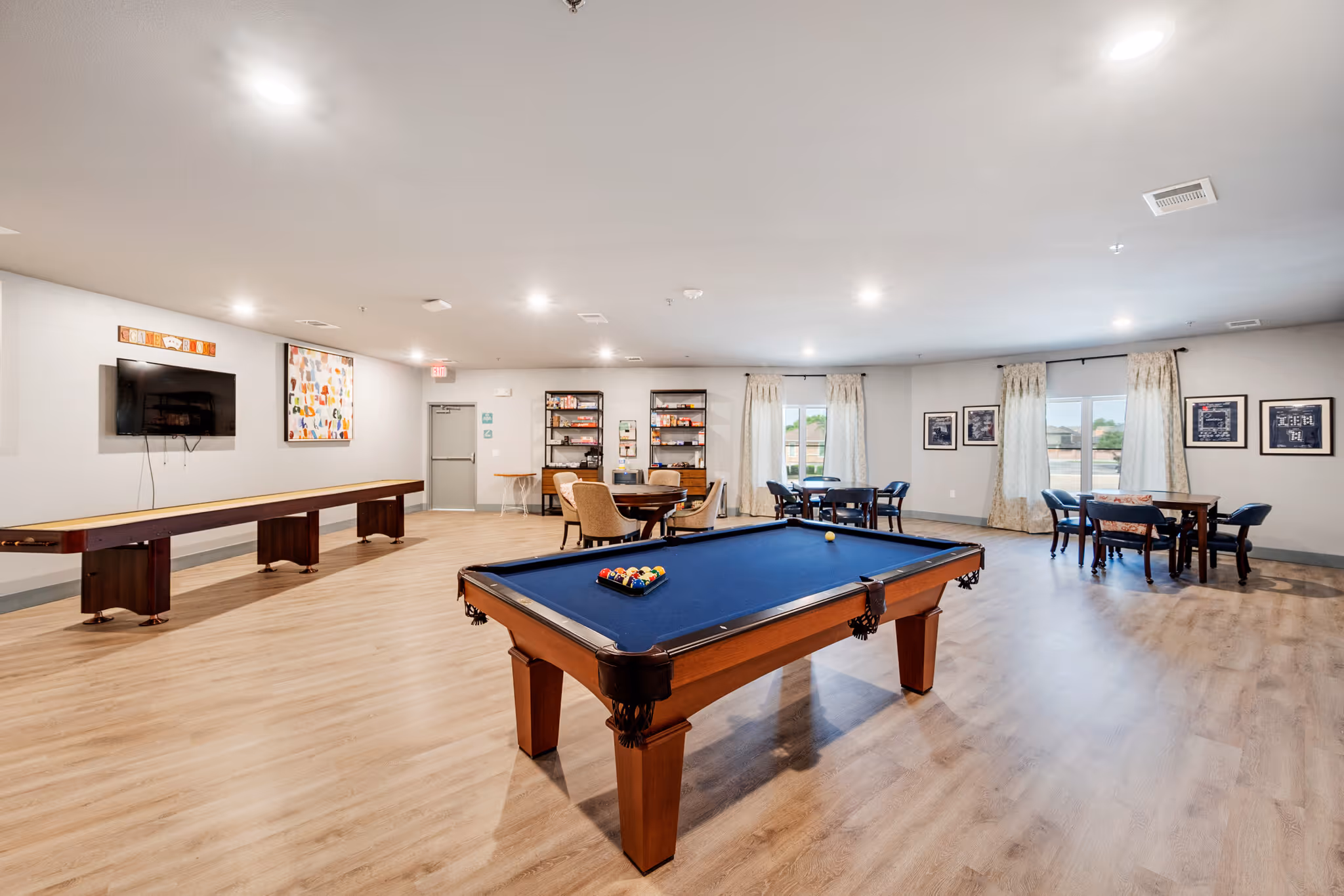 Clubhouse room with table games and lounge seating