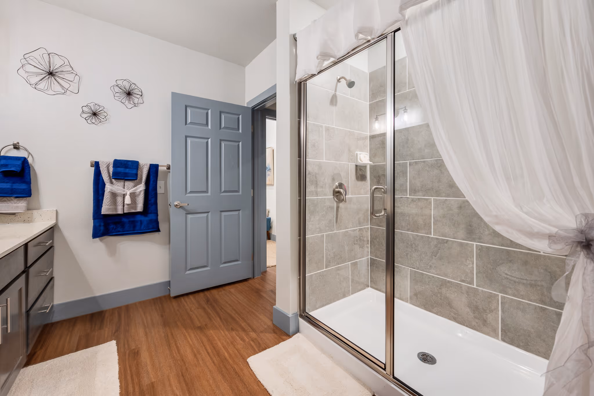 Furnished bathroom with walk in shower