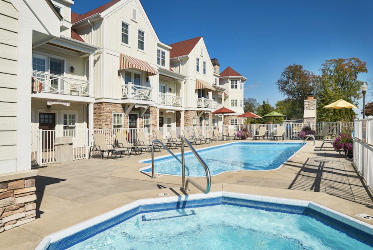 The pool at the inn at the lake in Holland, MI: a serene oasis for relaxation and enjoyment amidst beautiful surroundings.