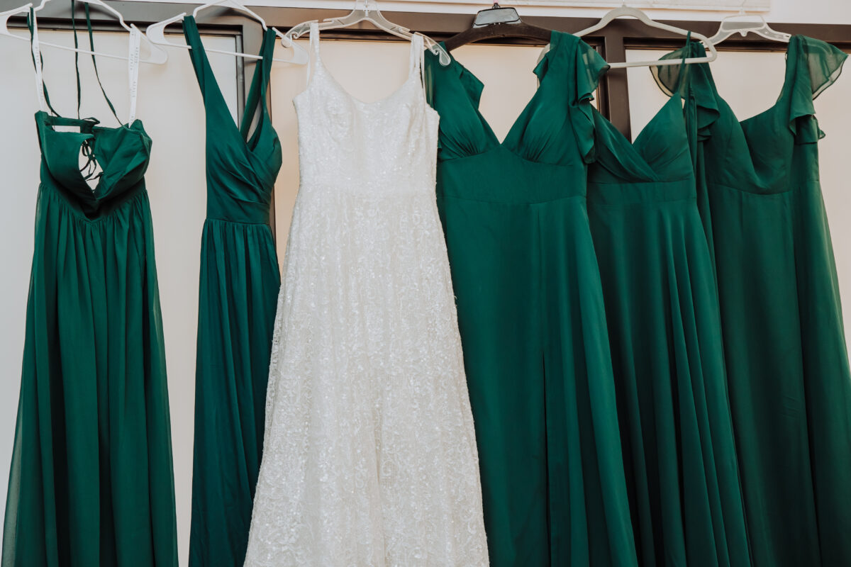 Green wedding dresses hanging on hangers - part of spotless simplicity at Nicole & Austin's wedding day coordination.