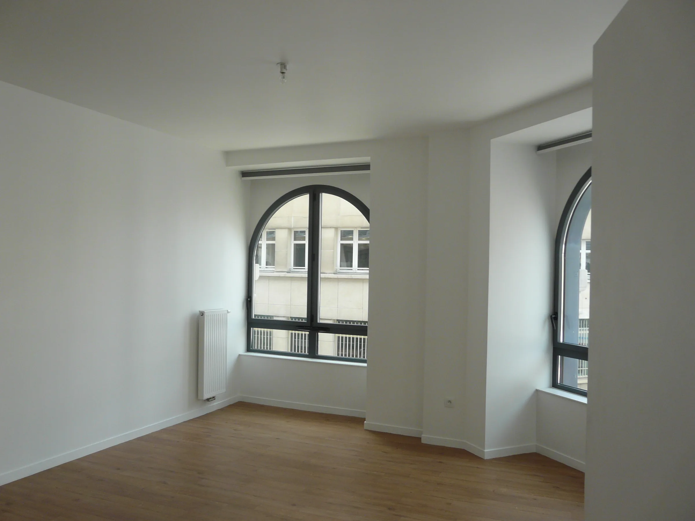 Séjour — transformation d'un immeuble de bureaux en logements sociaux, place de la Bourse, Paris 2e