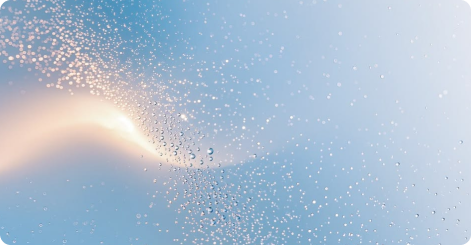 Light blue background with a curved streak of glowing golden particles and scattered dots.