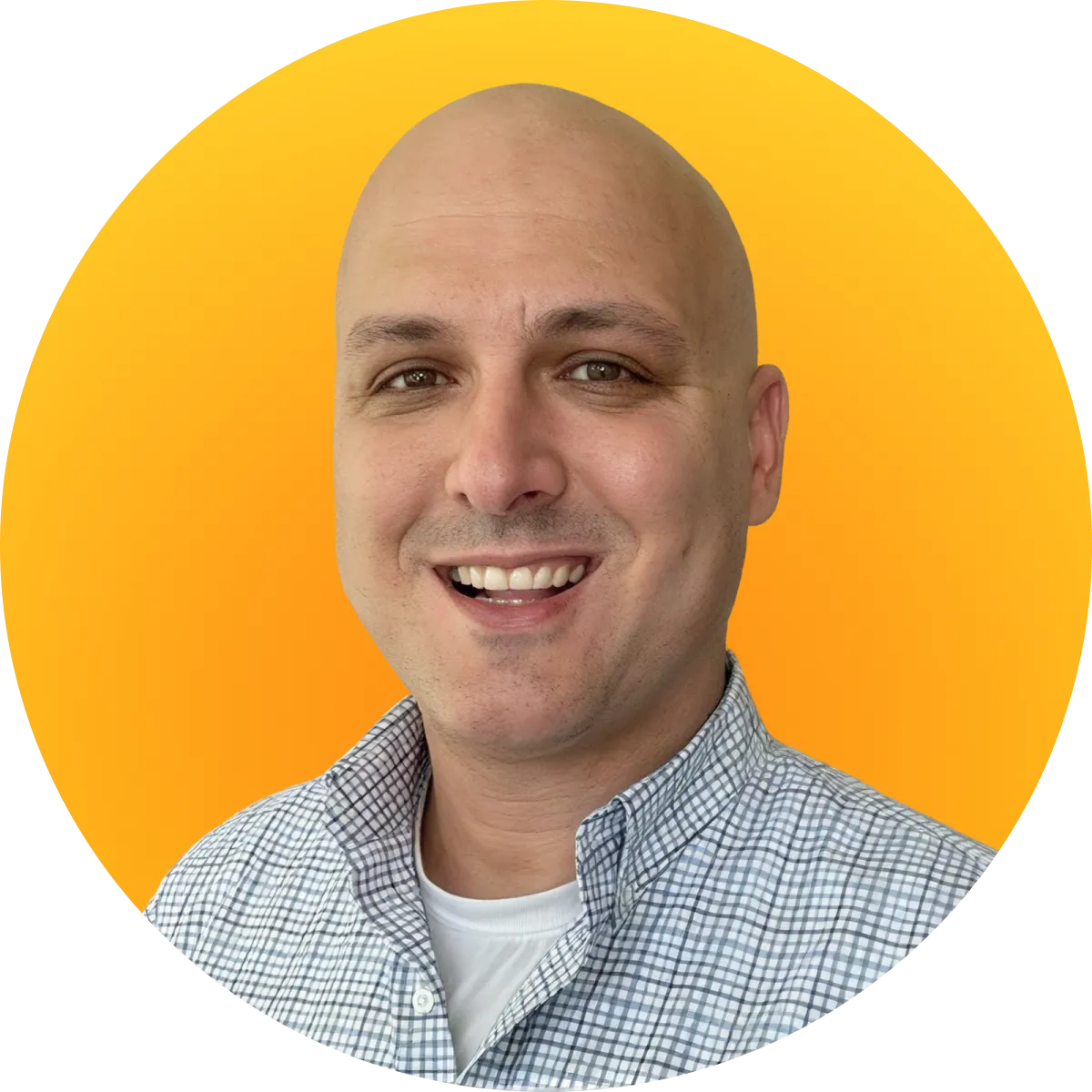 Smiling bald man wearing a checkered shirt with white undershirt on an orange circular background.