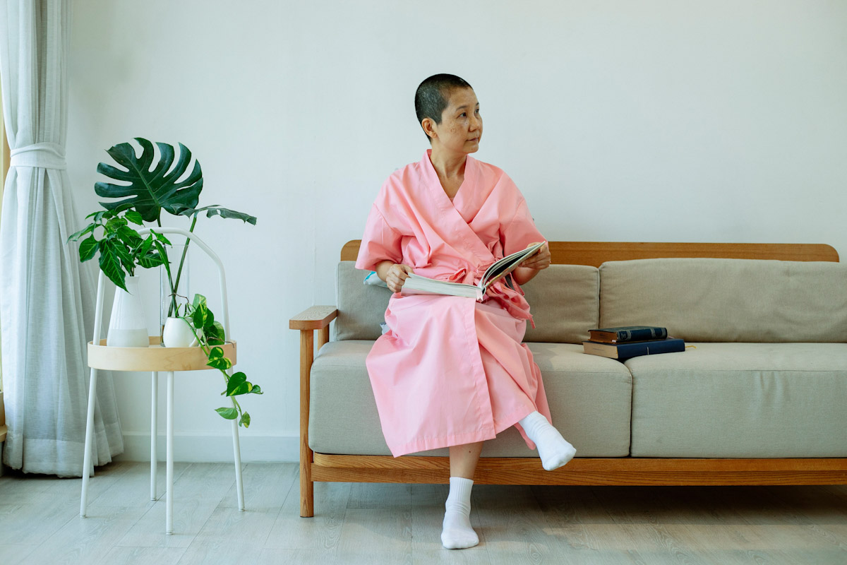 A woman rests on a couch