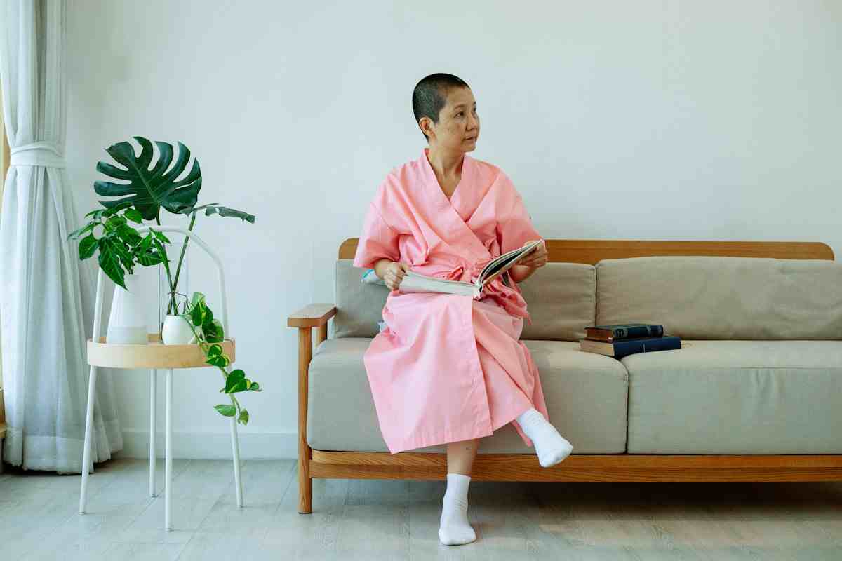 A woman rests on a couch