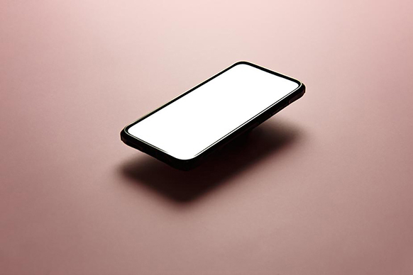 Cell phone floating over black background