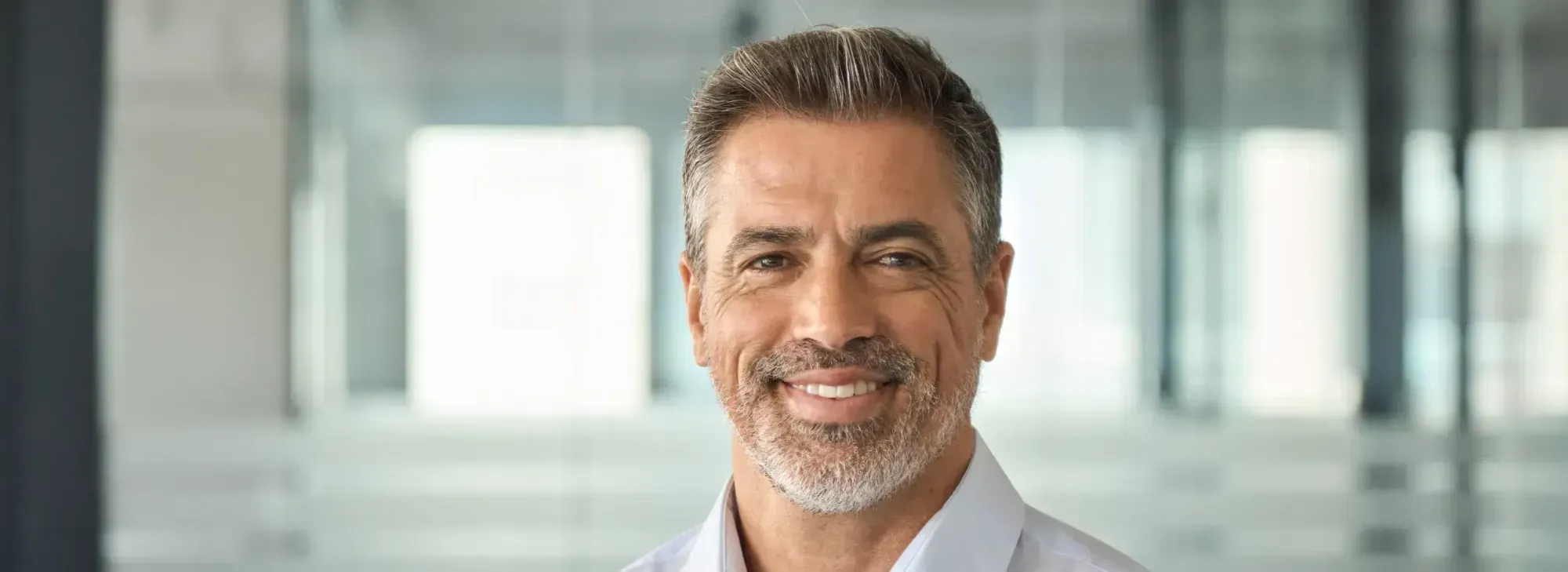 A close up of a person wearing a white shirt.
