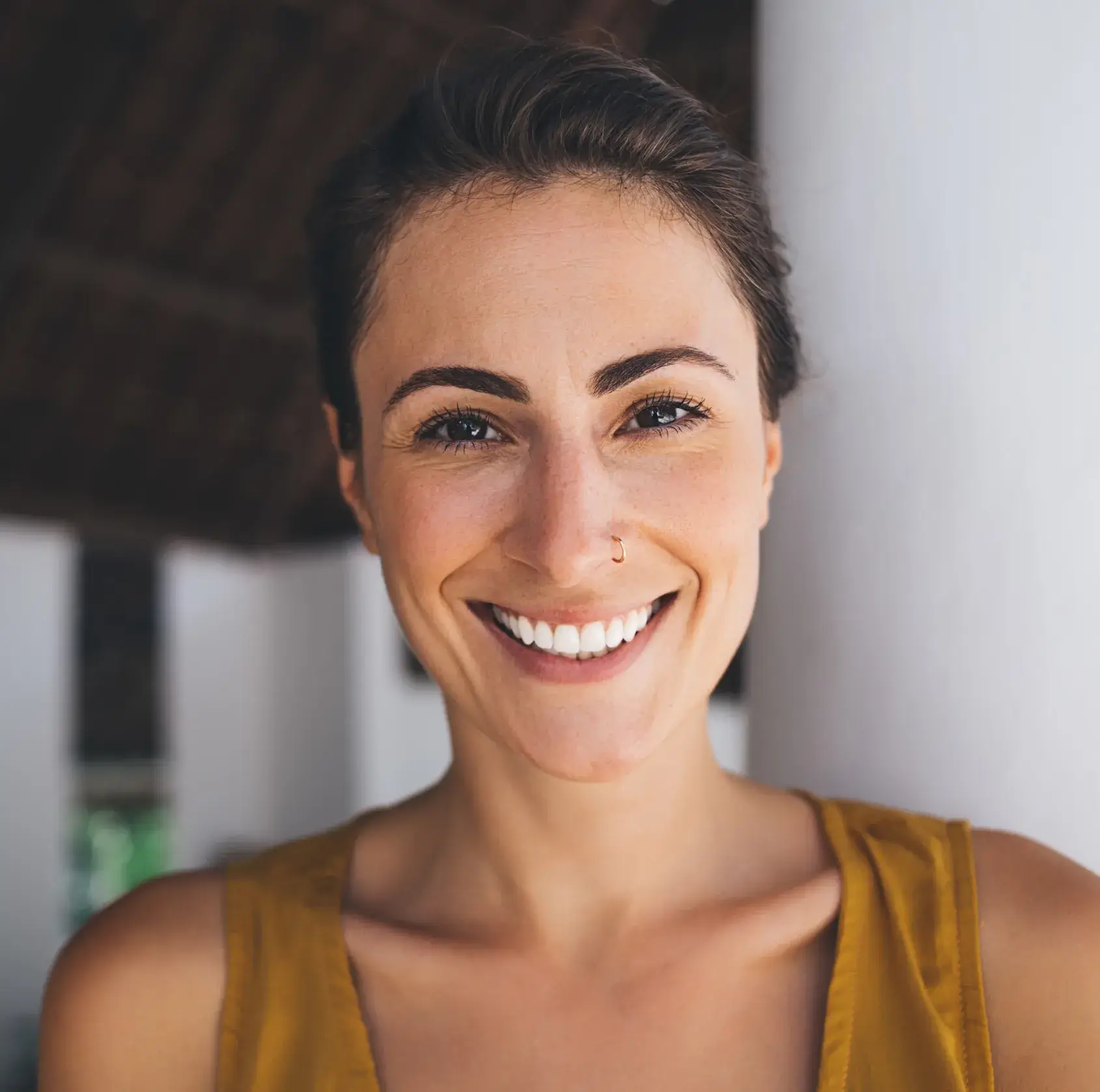 A woman with a smile on her face.