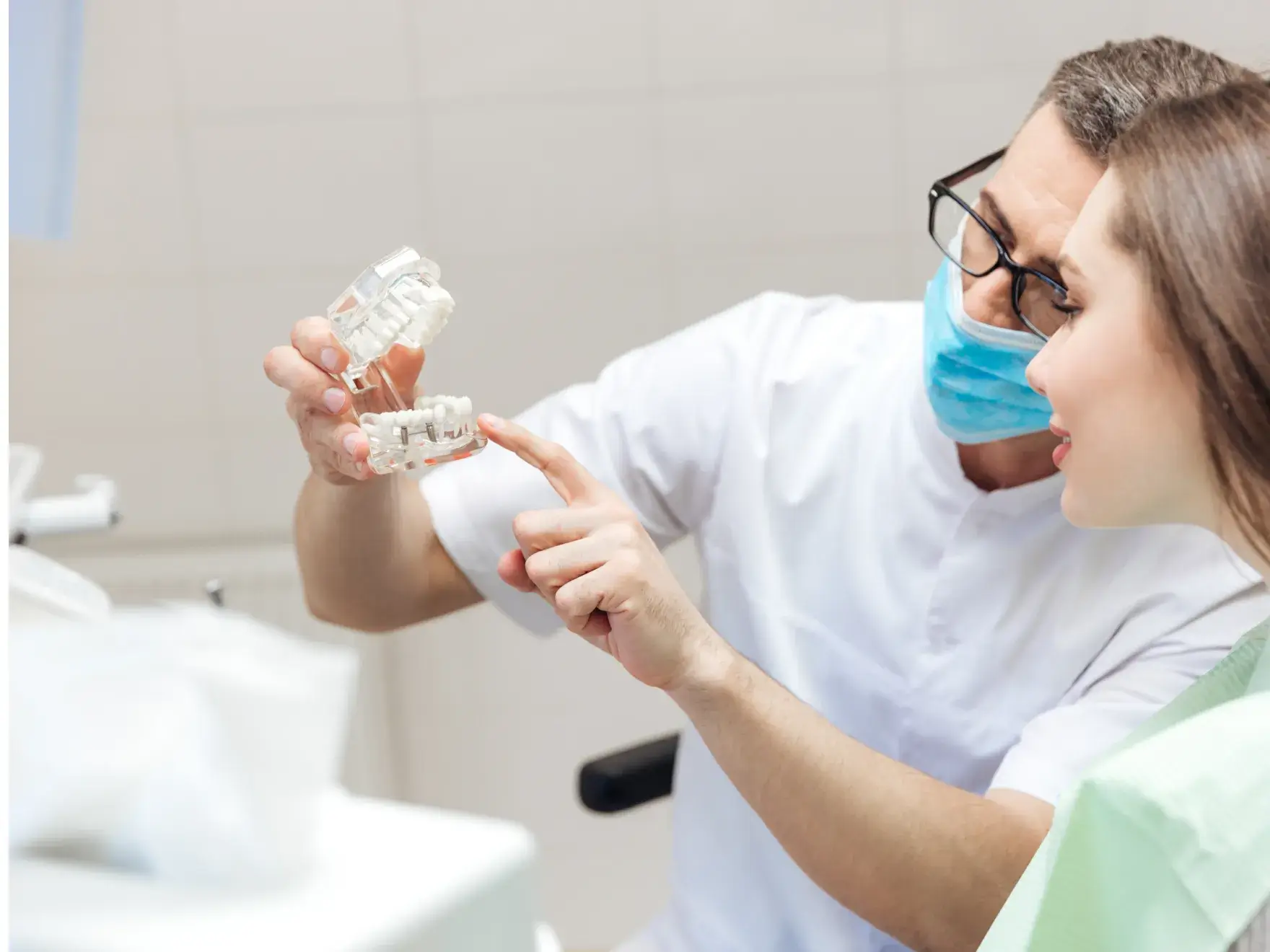 A man and a woman in a dentist's office.