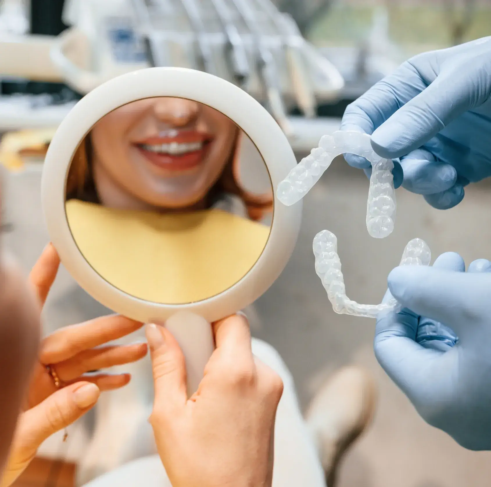 A woman getting her teeth checked by a dentist.