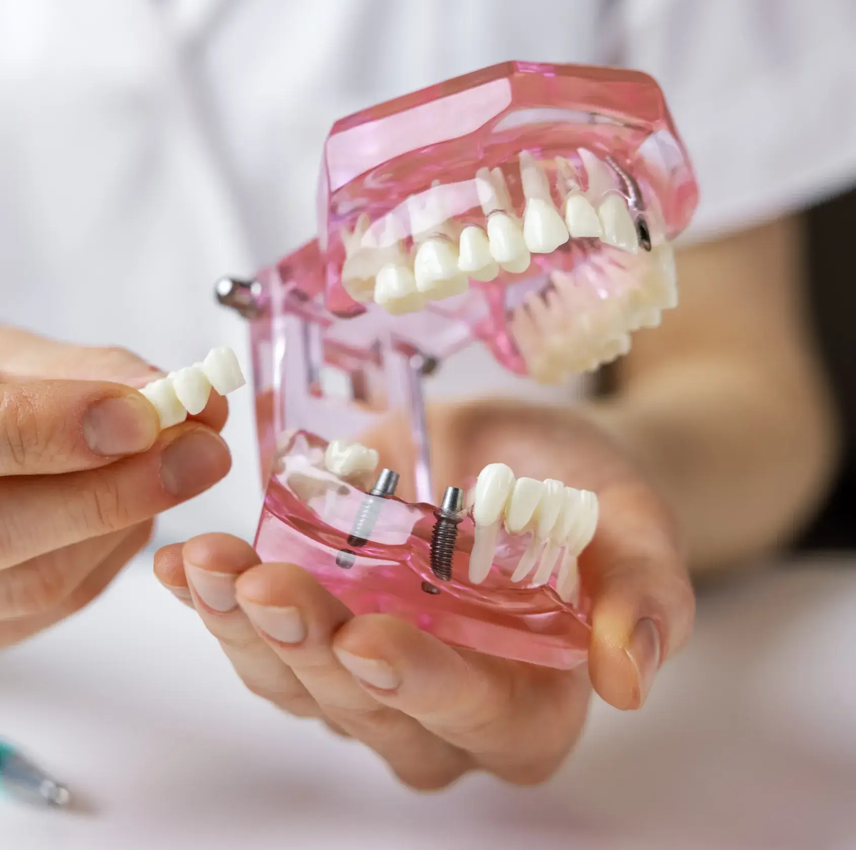 A person holding a toothbrush in their hands.