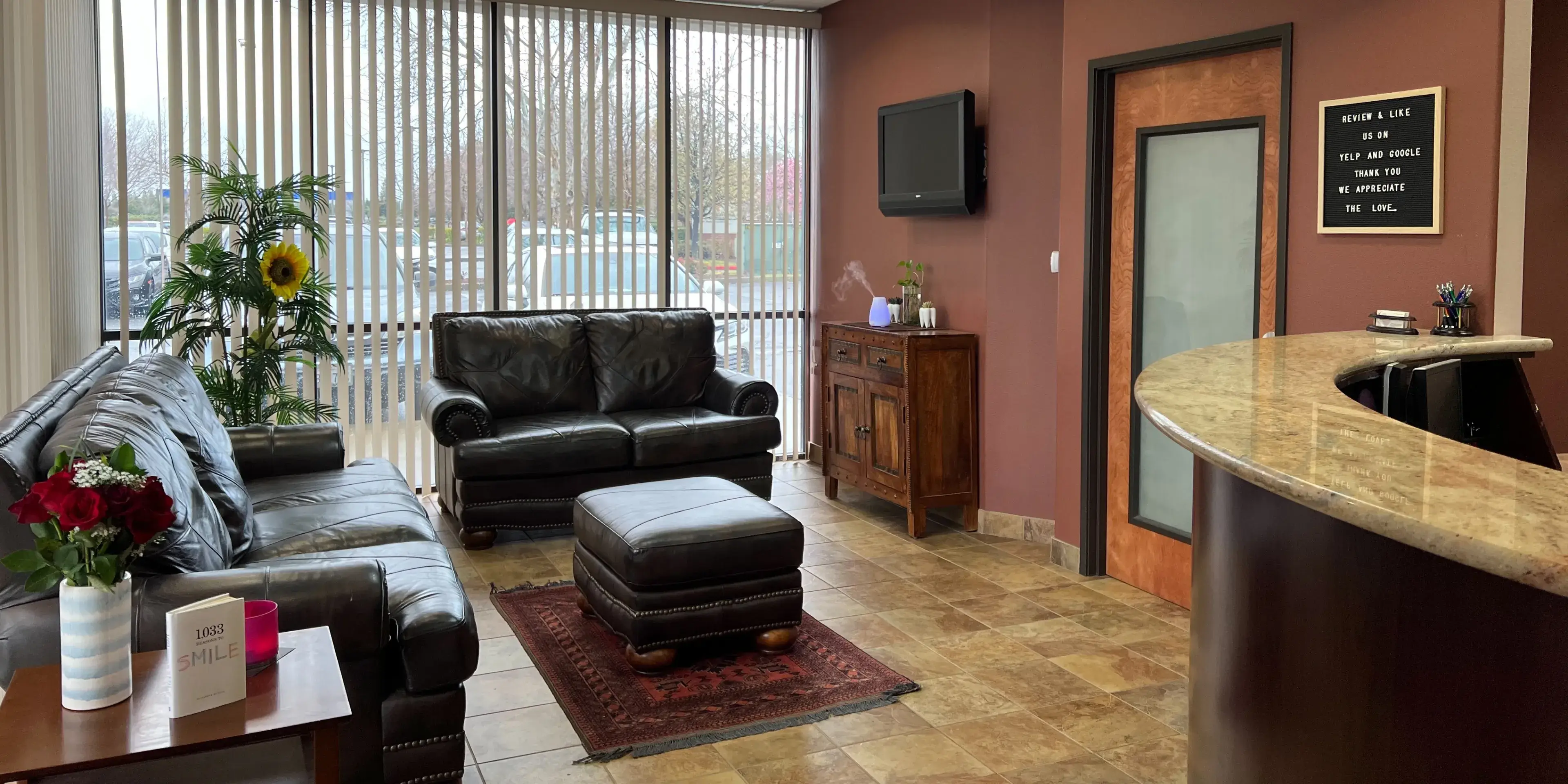 A living room filled with furniture and a bar.