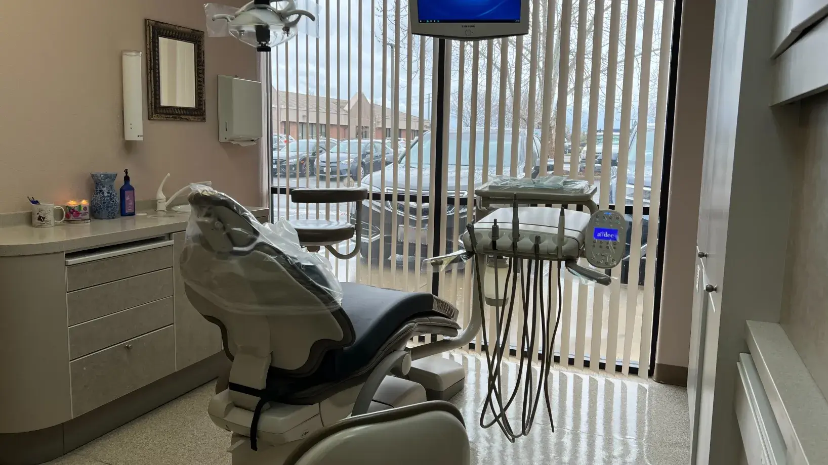 A dentist's office with a large window overlooking the water.