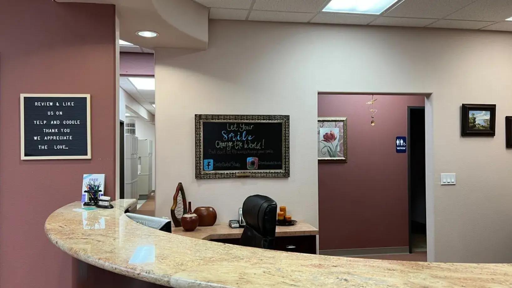 A reception area with a chalkboard on the wall.