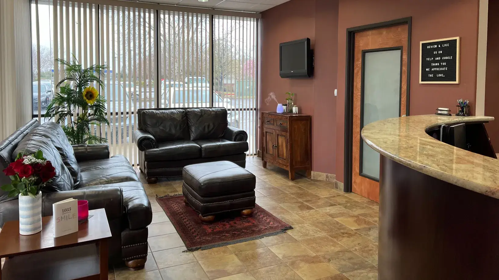 A living room filled with furniture and a bar.