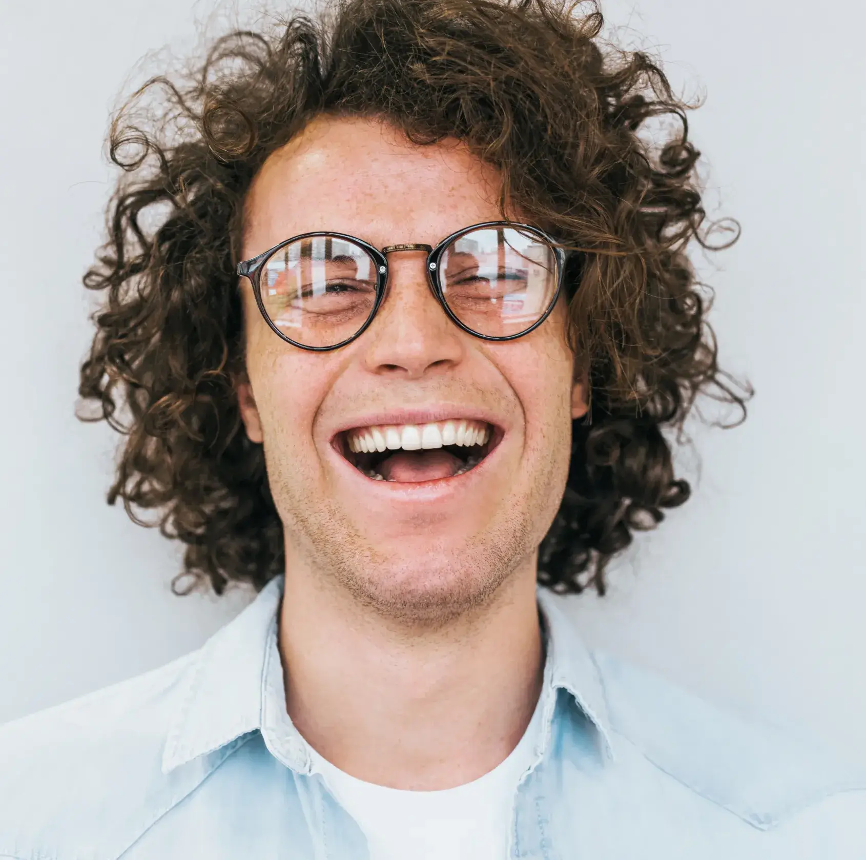 Smiling man wearing glasses