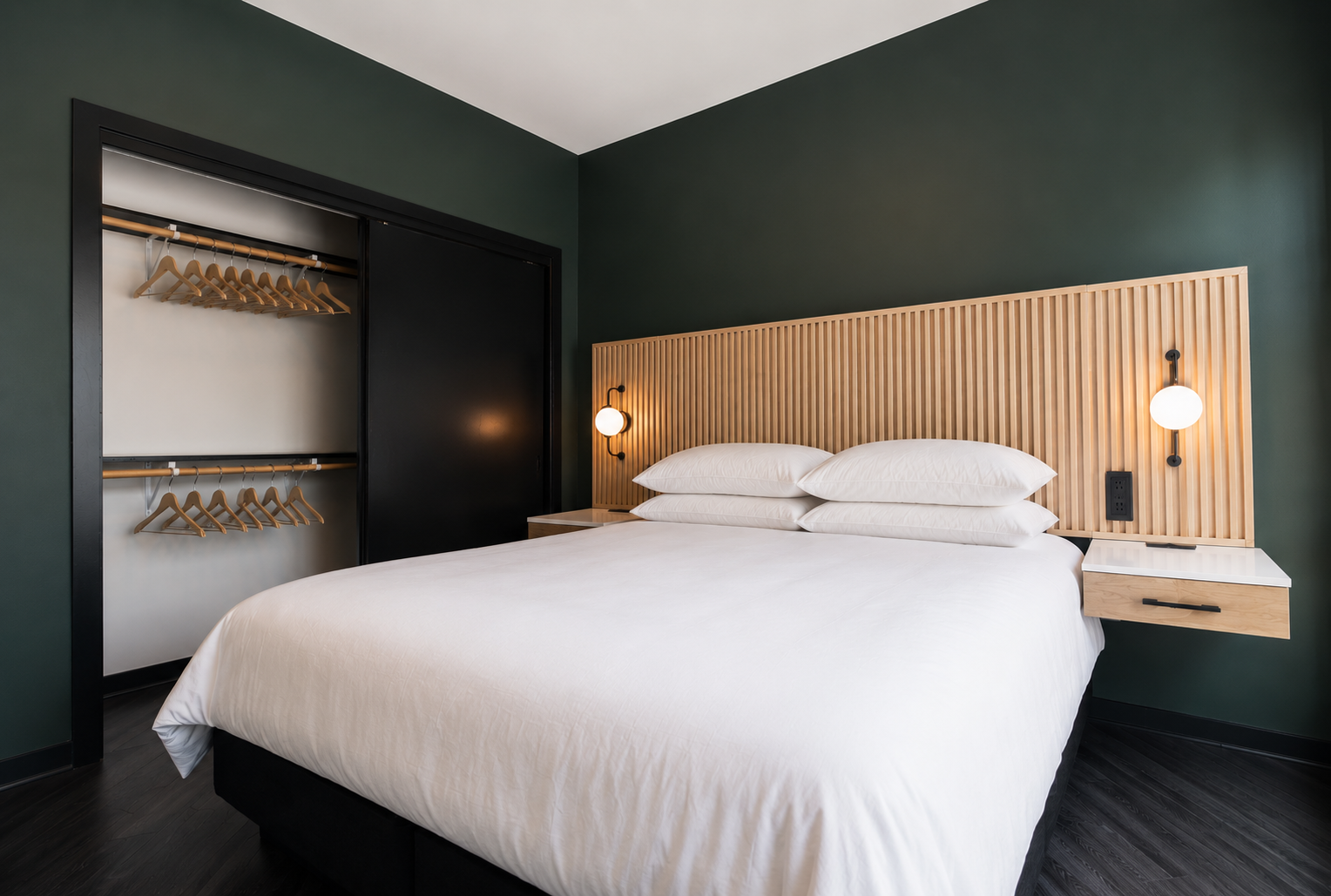 King bedroom with floor to ceiling windows at The Quinley boutique hotel in The Gulch, Nashville