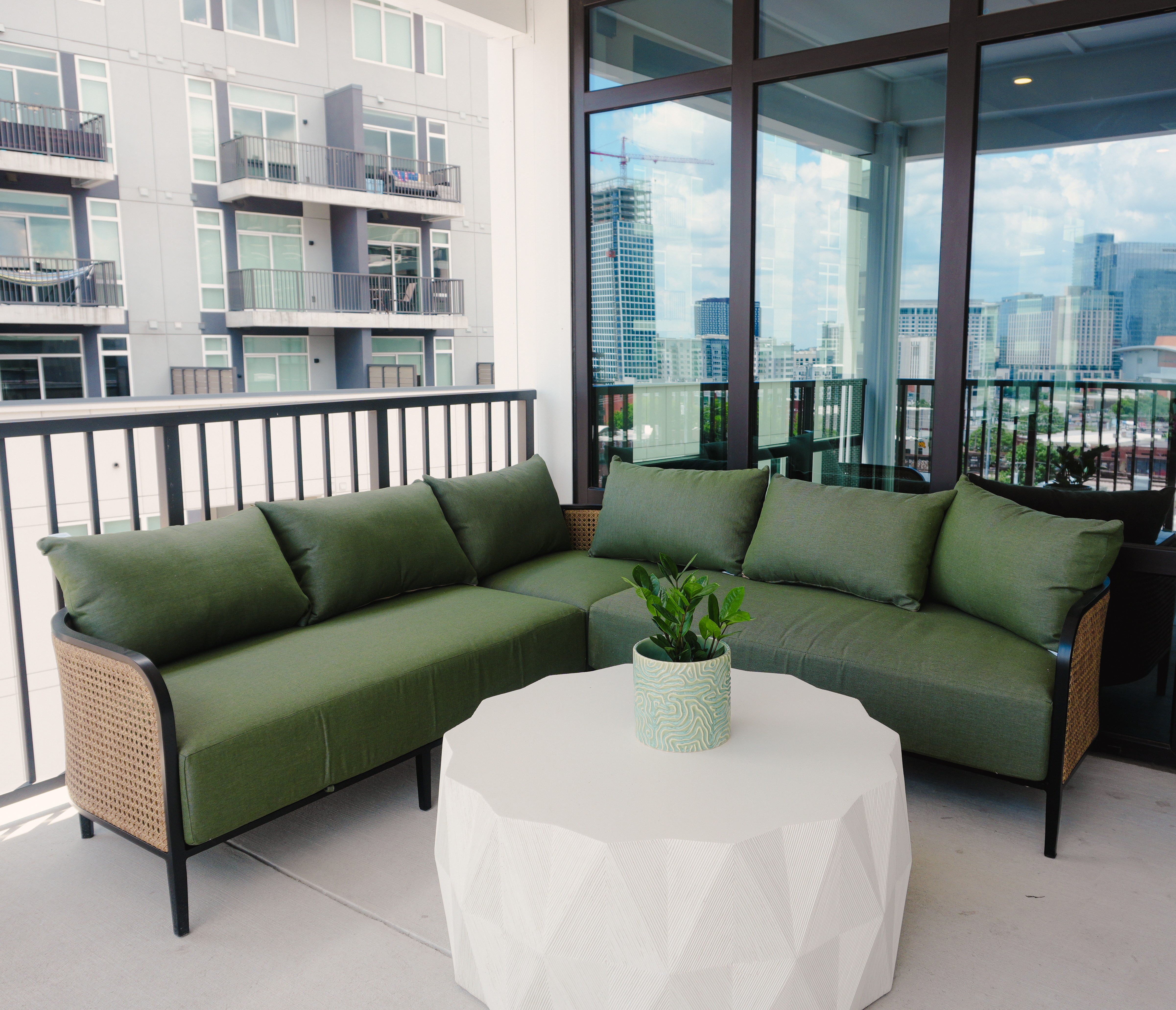 Open door to the balcony in a boutique hotel room suite at The Quinley in The Gulch, Nashville