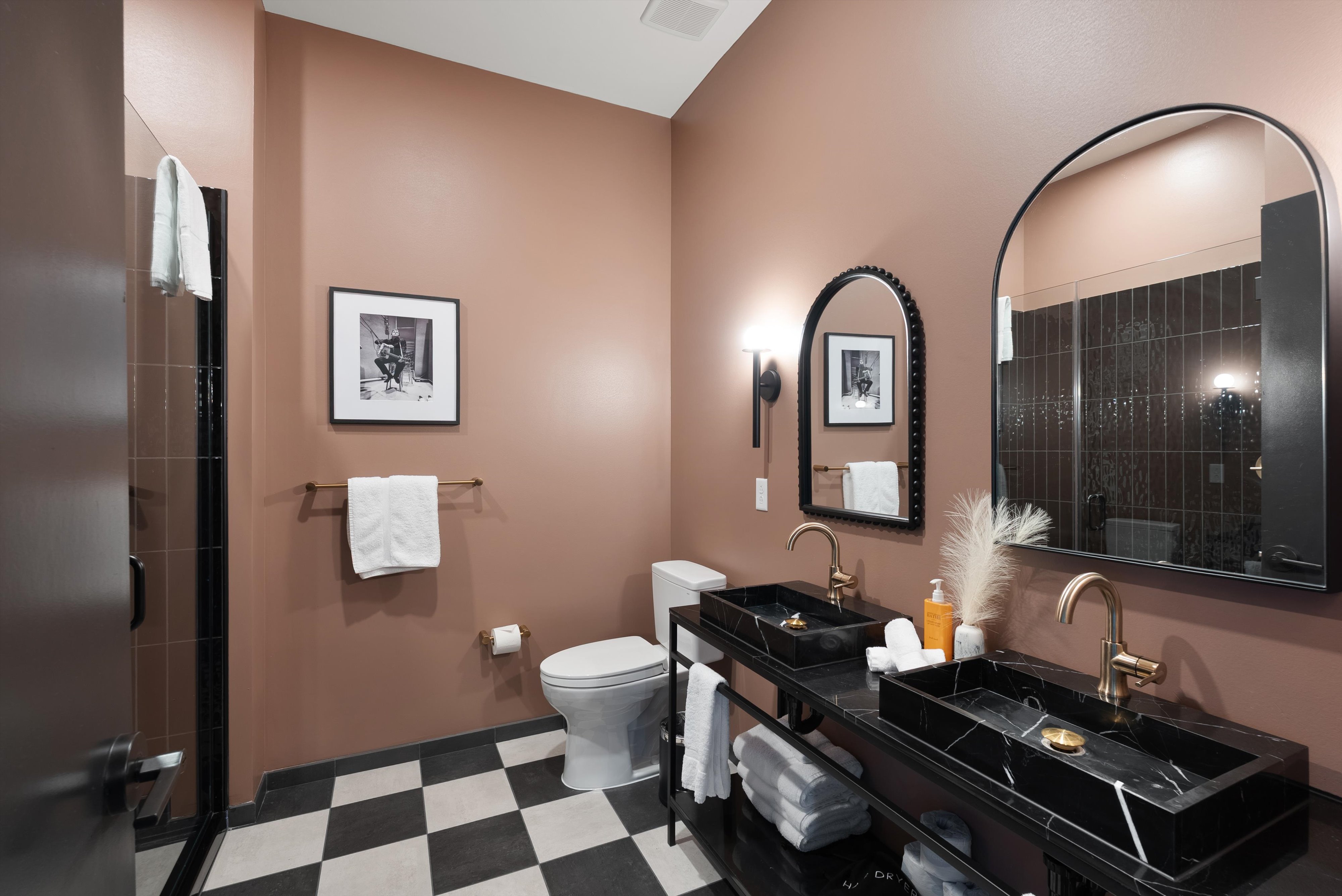 Bathroom with marble sinks at The Quinley boutique hotel in The Gulch, Nashville