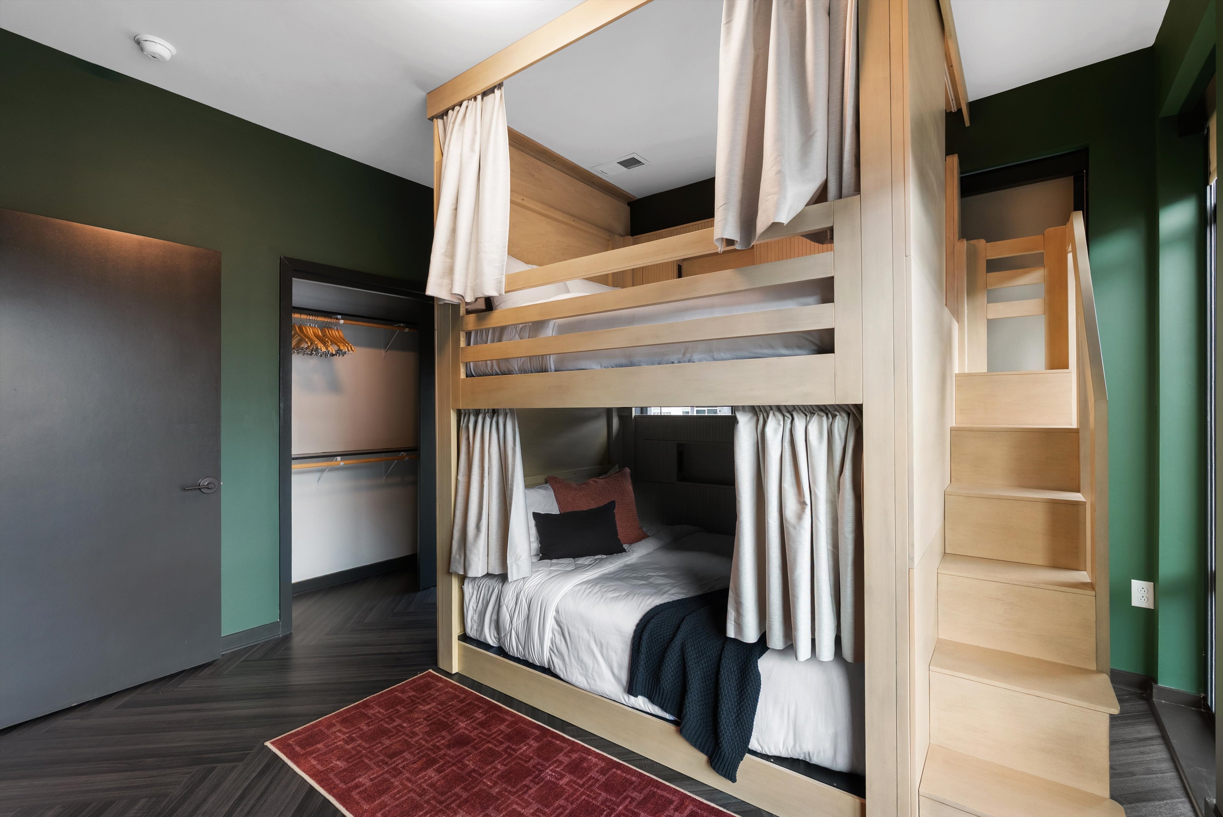 Large bunk beds with stairs at The Quinley
