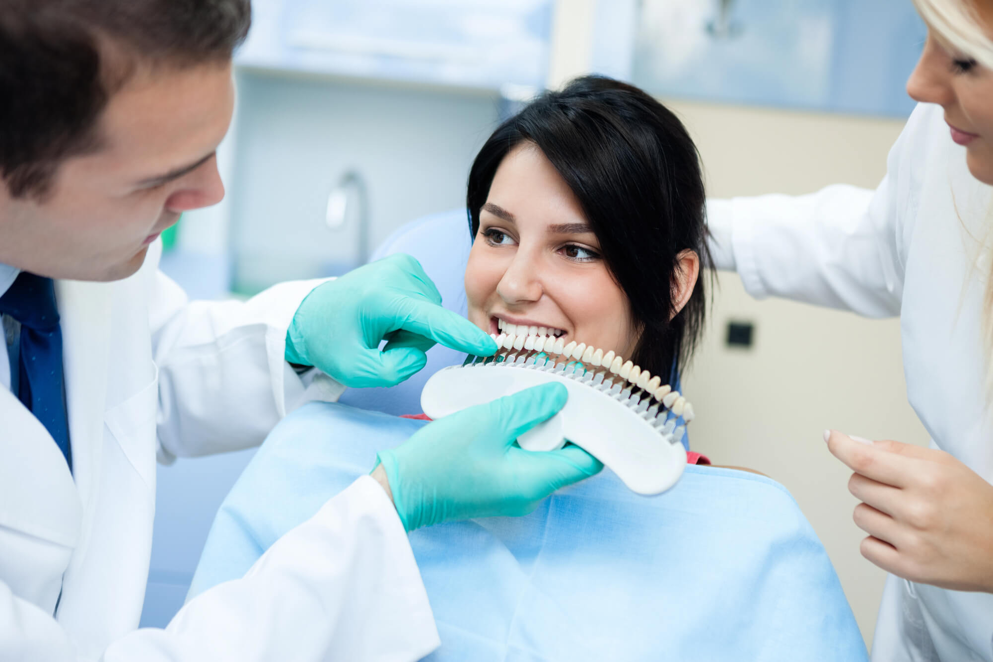 woman choosing shade for her teeth whitening