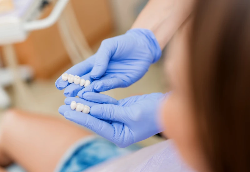 dentist showing dental bridges