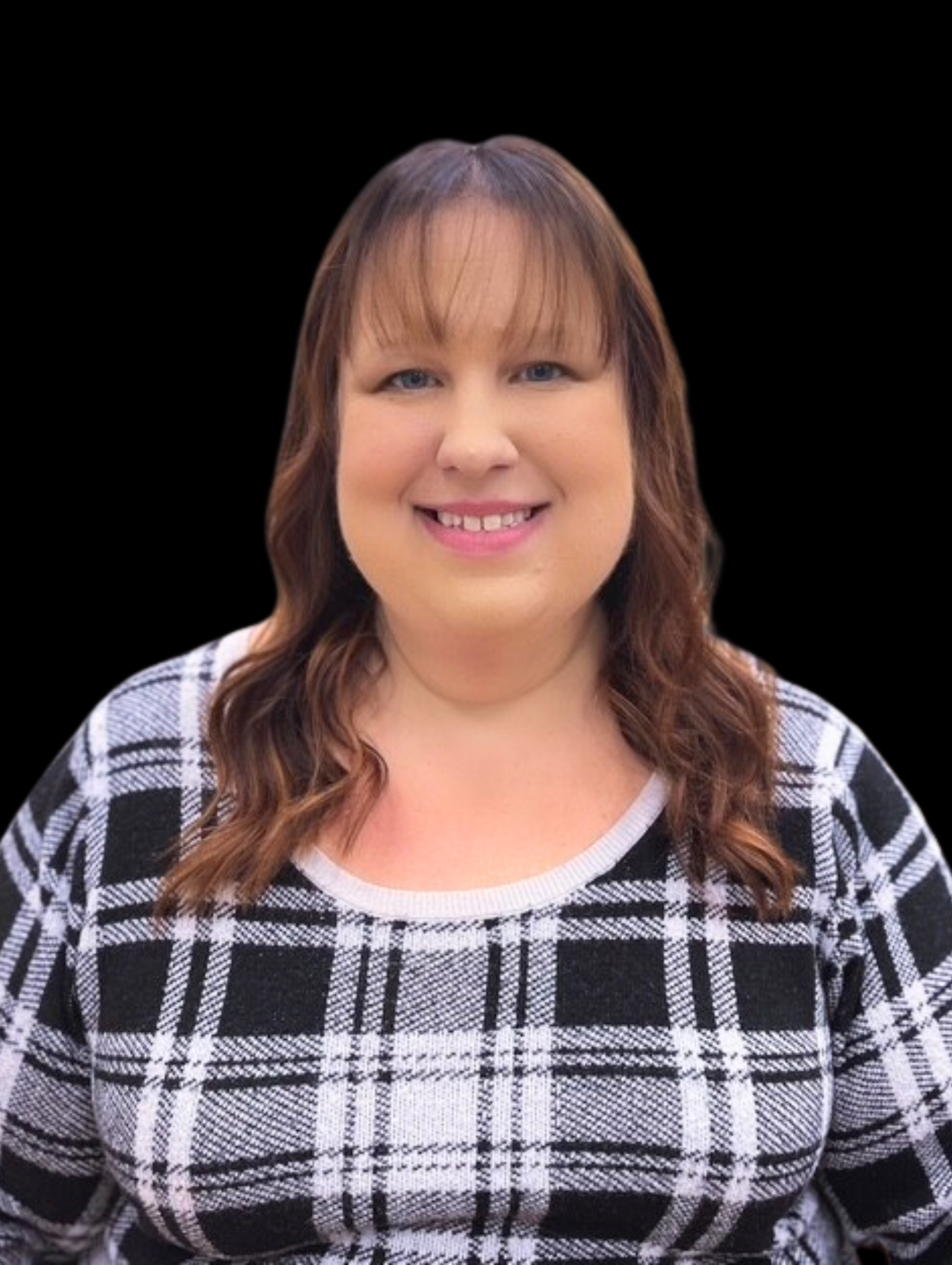 Smiling woman with shoulder-length brown hair wearing a black and white plaid top against a black background.