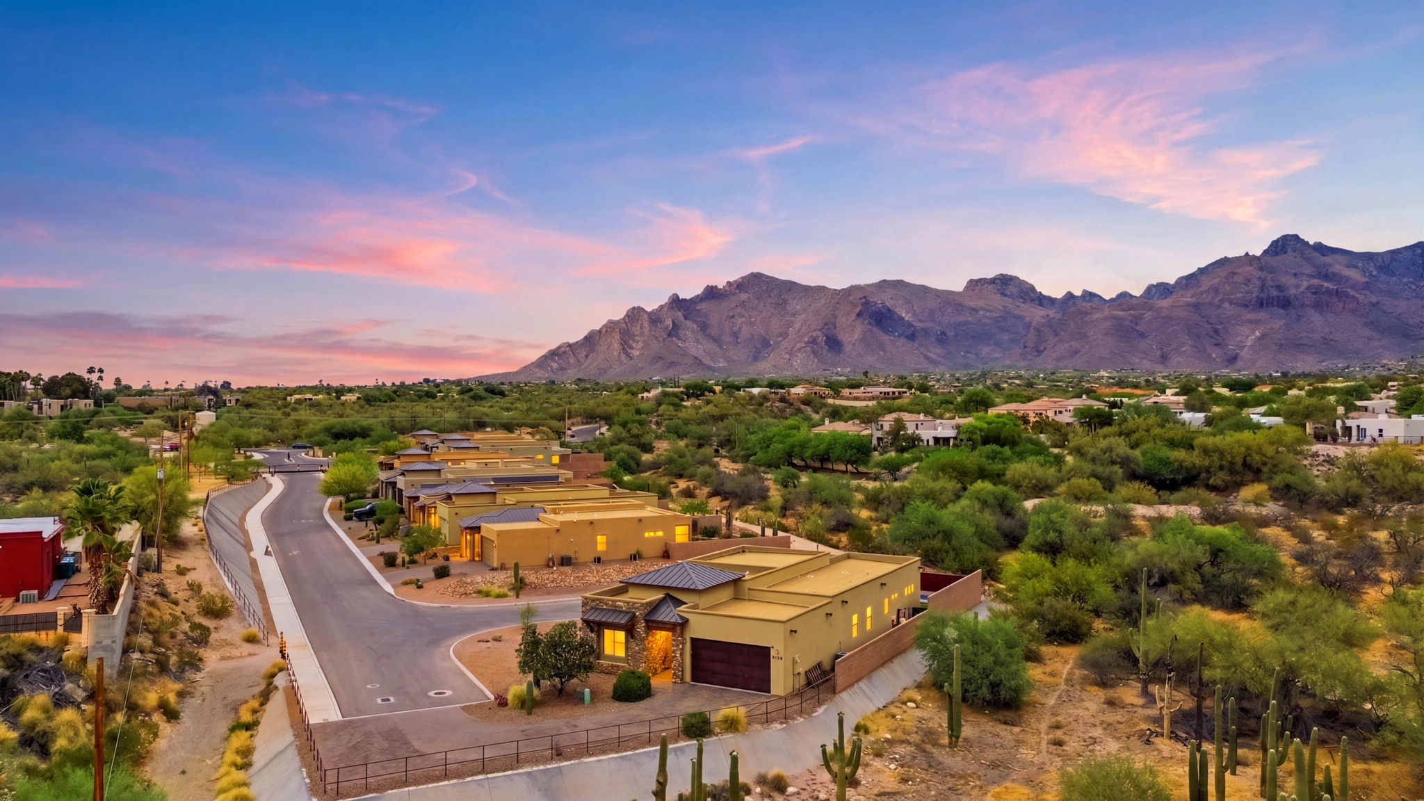 Aerial view of a Tucson home and desert at pink twilight