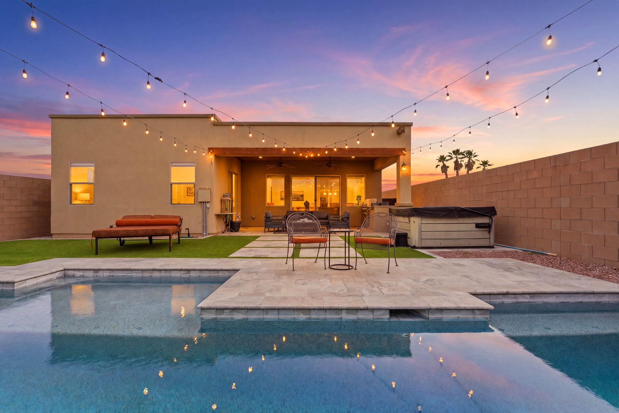Luxury outdoor living with string lights at twilight
