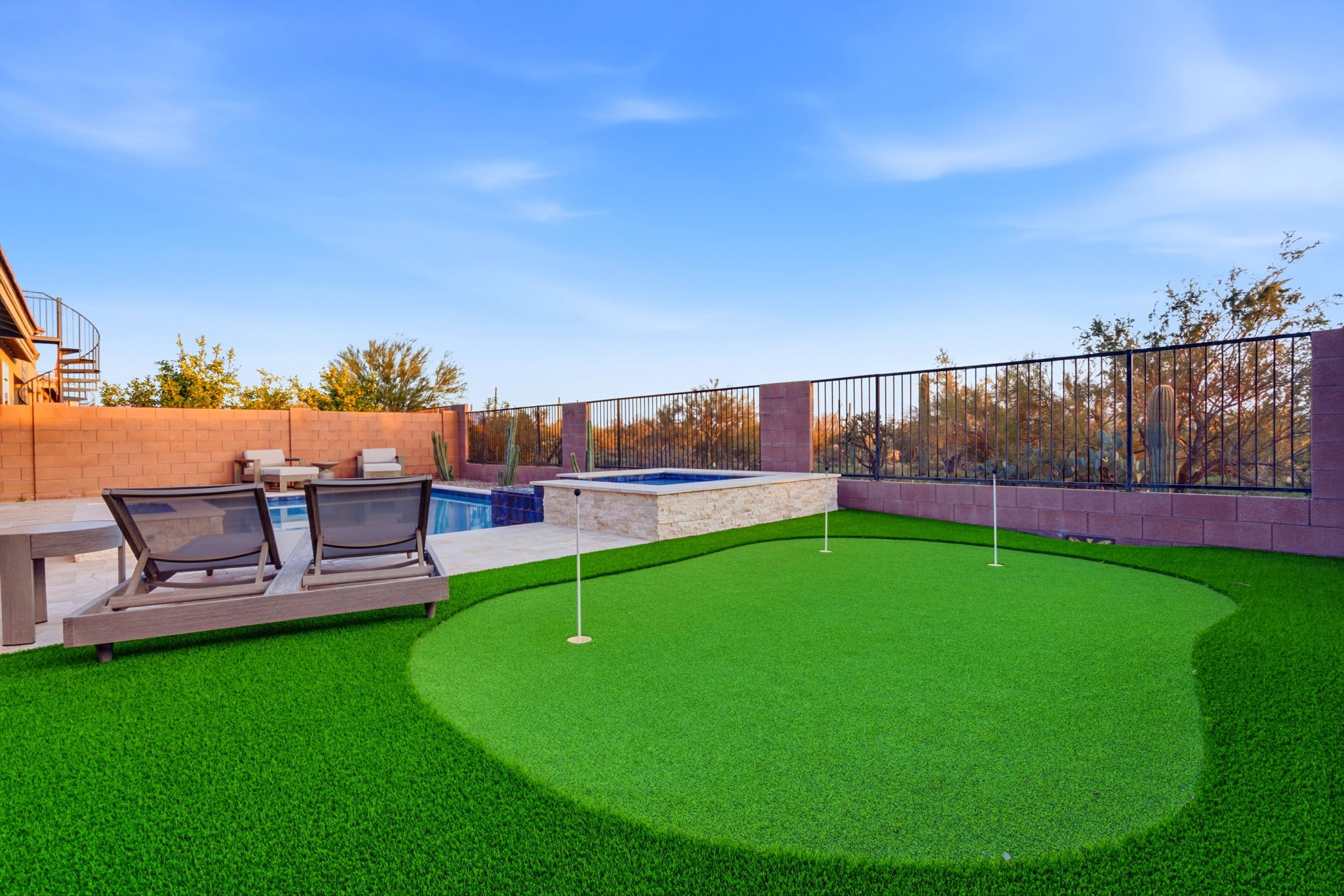 Backyard putting green beside a Tucson home