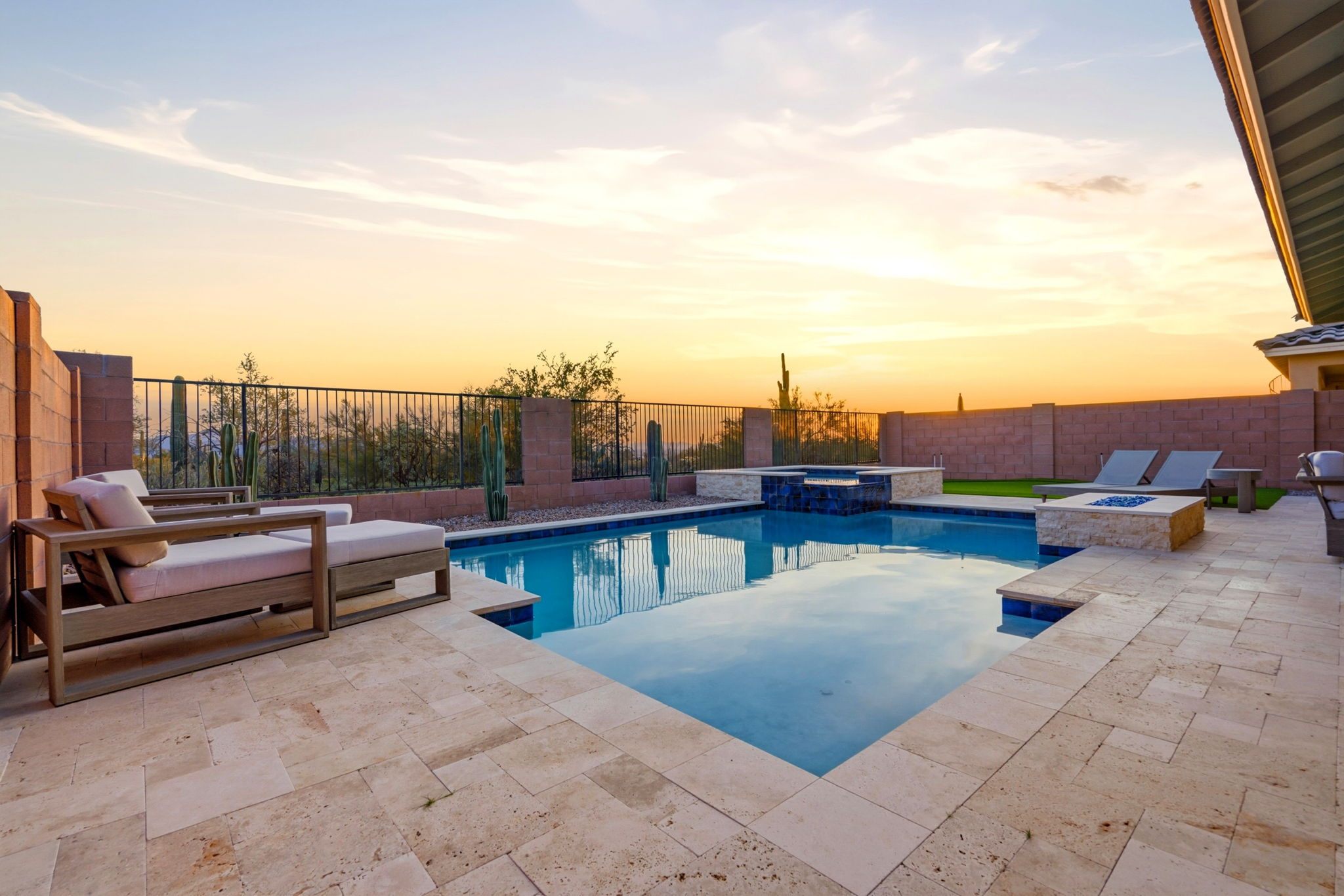 Modern pool and home at twilight