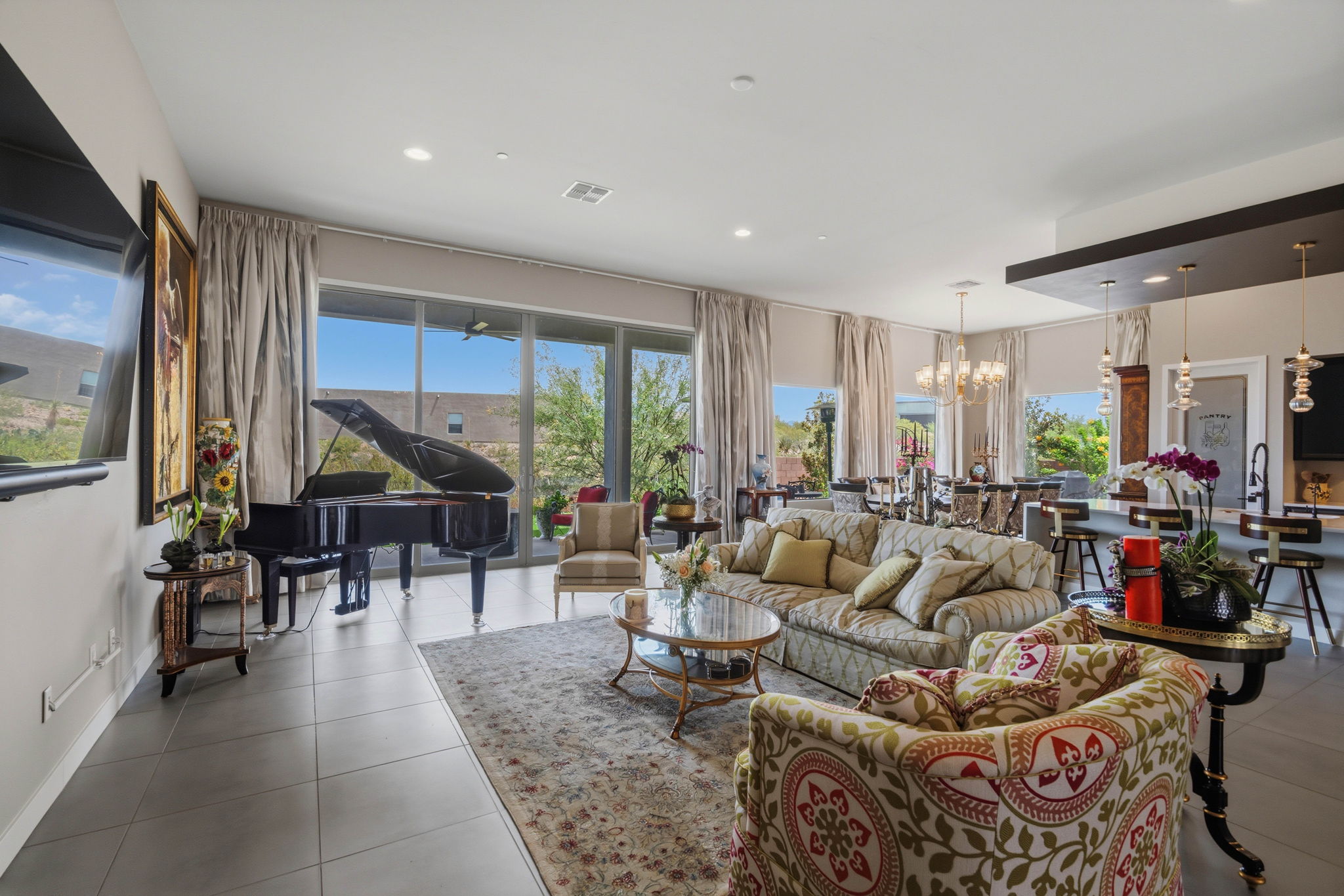 Luxury living area with piano and large windows