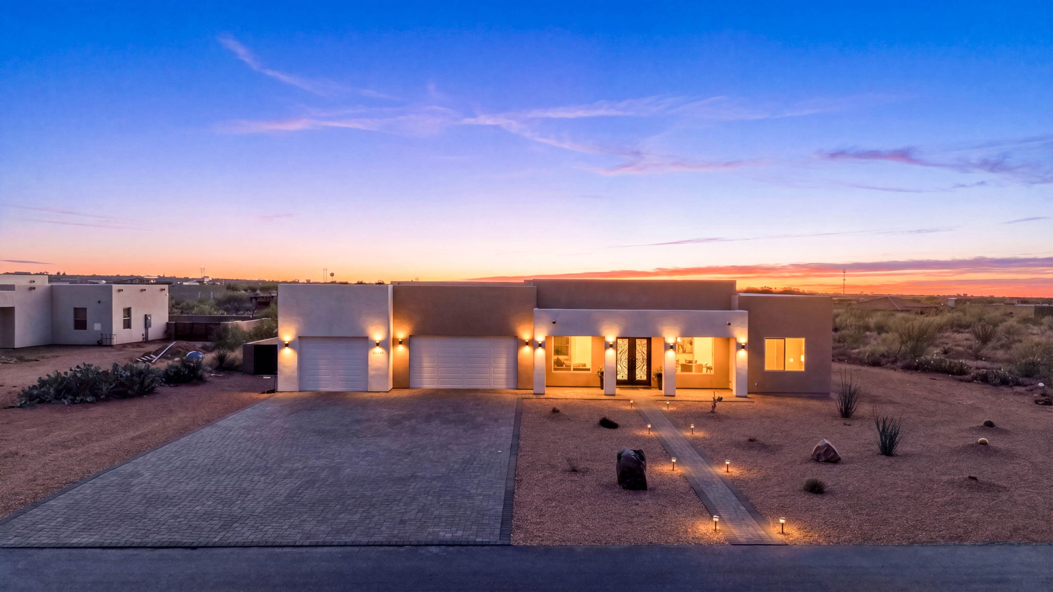 Elevated view of a contemporary luxury home at dusk