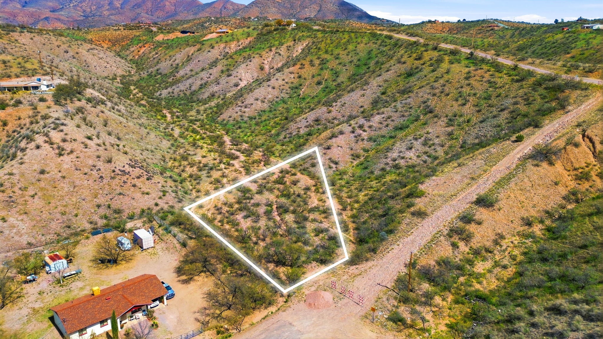 Desert hillside parcel outlined in white