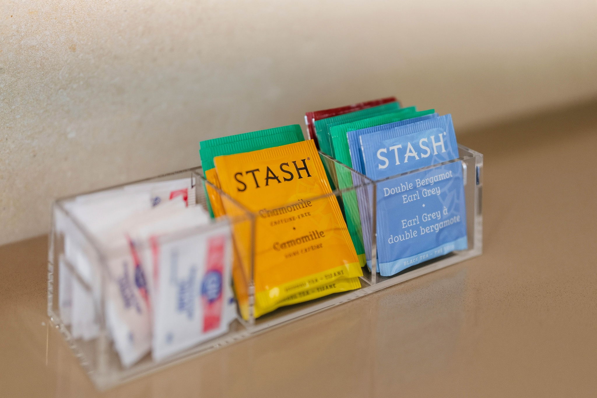 Guest tea selection neatly arranged on a counter