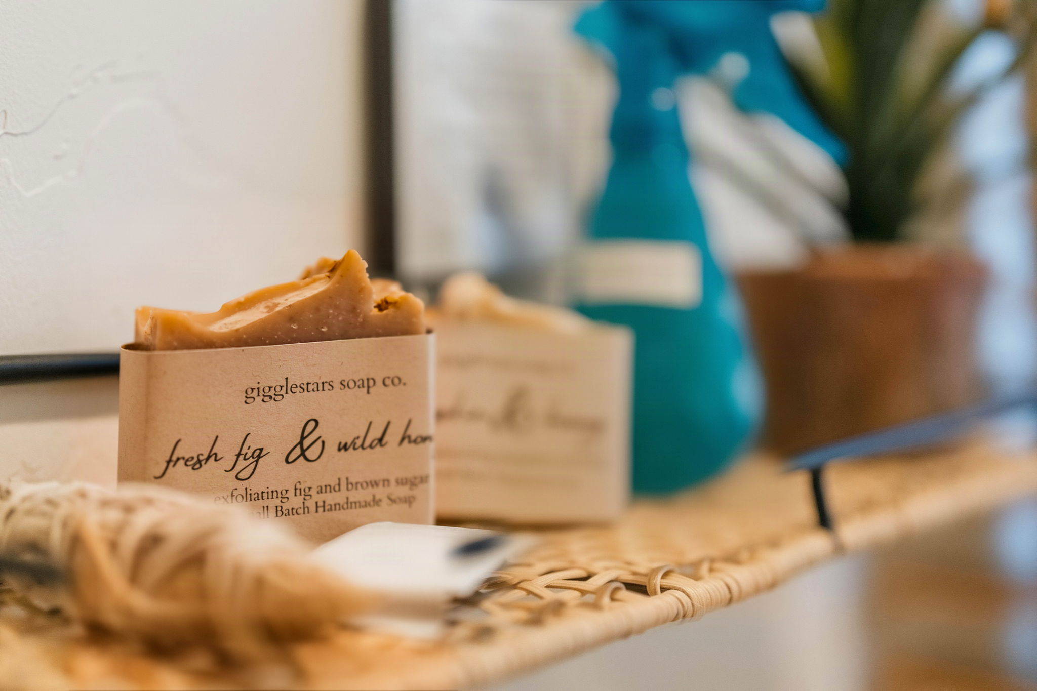 Handcrafted soap and guest bath amenities on a woven tray